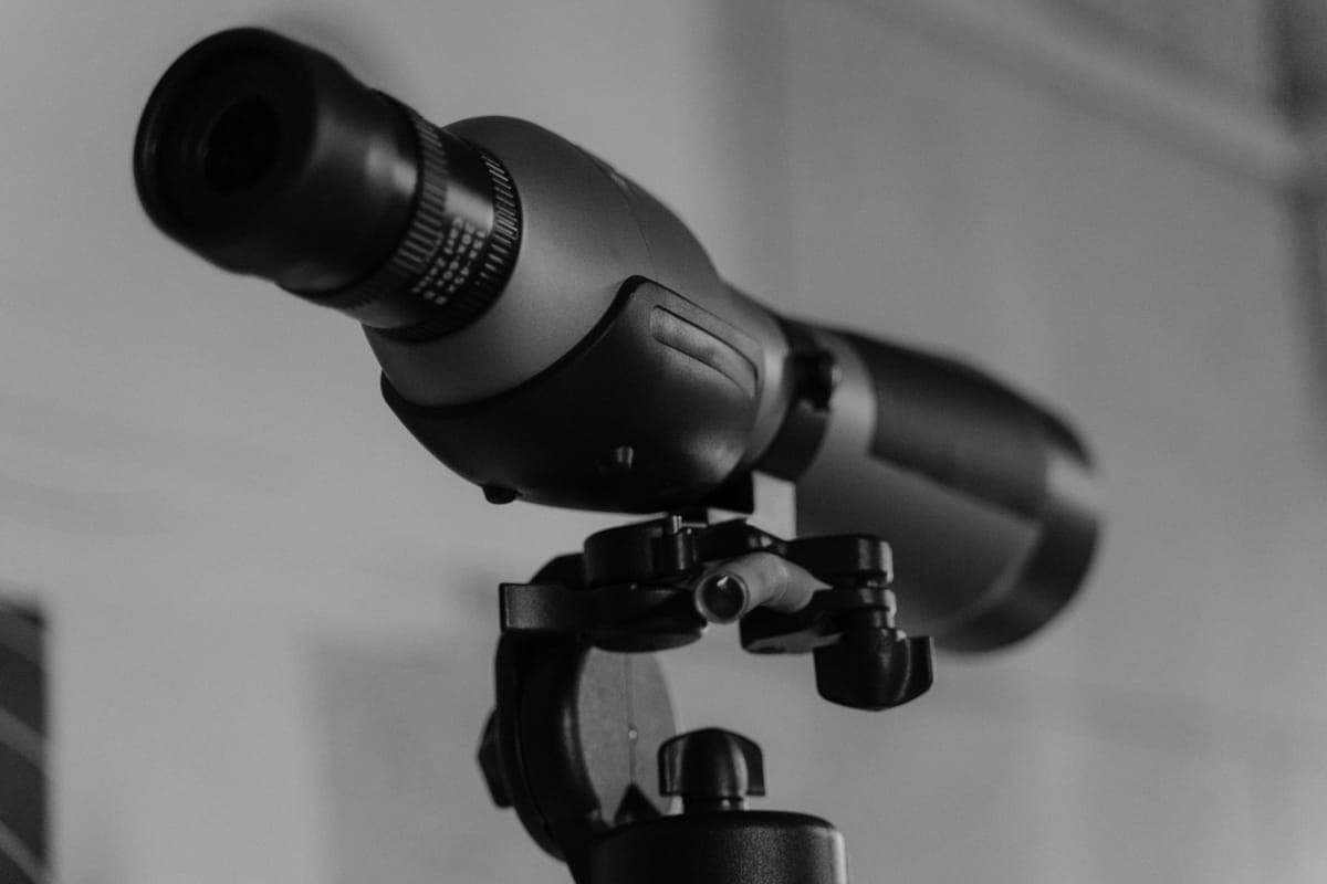 A telescope lens mounted on a tripod